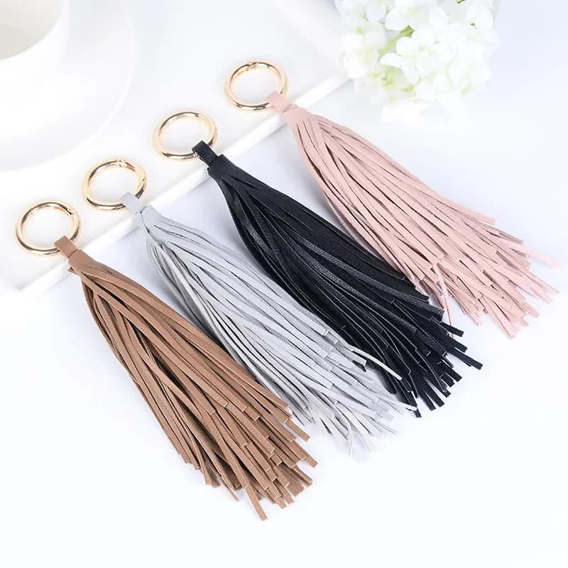 Porte-clés pompon en cuir pour femme et homme, porte-clés bibelot, breloque de sac, pendentif, accessoires, cadeau de bijoux, porte-clés de voiture, roman