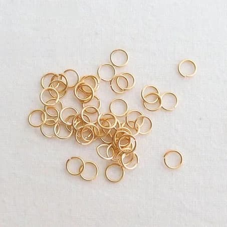 (3654)10g 3*0.5MM 4*0.7MM 5*0.8MM 6*0.9MM 8*1.2MM 10*1.2MM 24K couleur or véritable couleur or anneaux de saut anneaux fendus de haute qualité