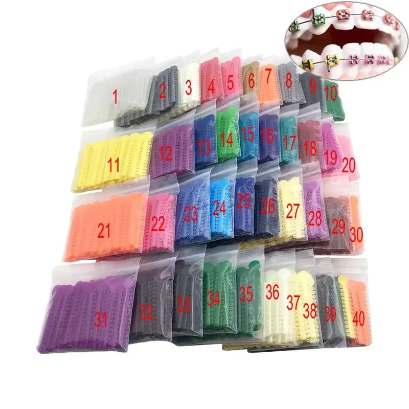 40 pièces/sac bandes de Ligature élastiques orthodontiques dentaires pour supports bretelles traitement Ortho 40 couleurs en option