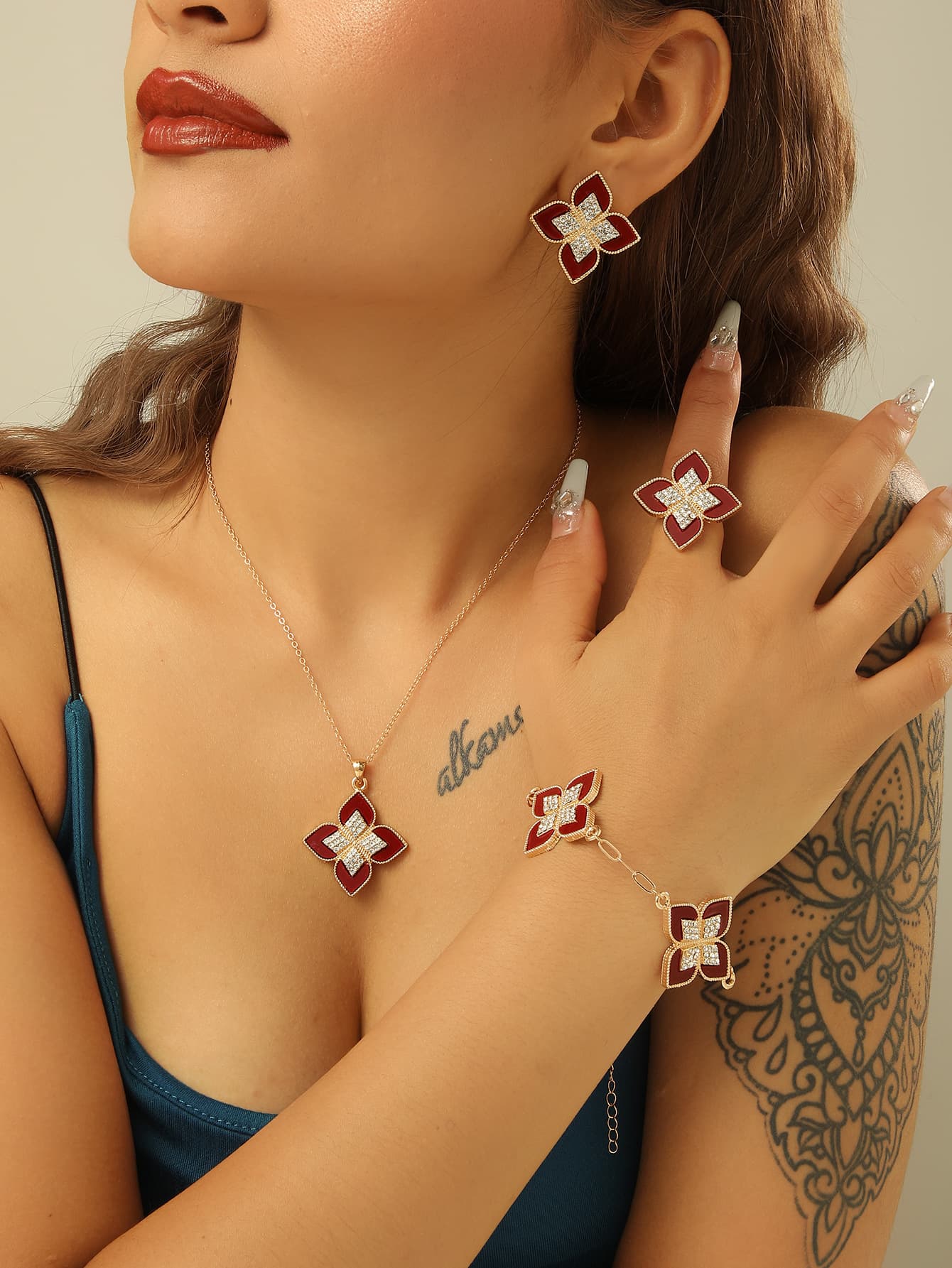 Hot-selling 4-piece fashion alloy rhinestone four-leaf clover necklace ring earrings bracelet