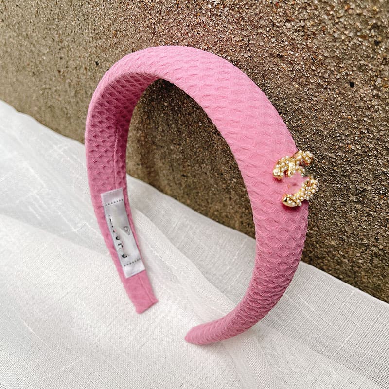 Bandeau en éponge rose à nœud haut, accessoire de cheveux simple et mignon, collection printemps/été 2026.