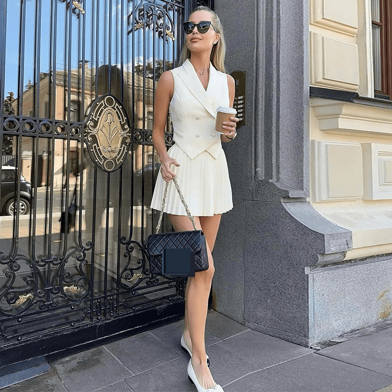 Ensemble mode été femme - Haut à col asymétrique et jupe plissée, ensemble deux pièces décontracté chic, mélange polyester-élasthanne respirant
