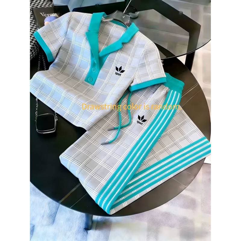 Ensemble deux pièces pour femme : polo imprimé 3D, pantalon large à manches courtes et color block.
