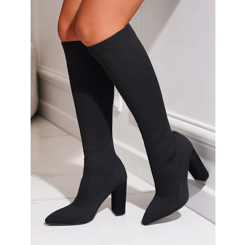 Plus-size thigh-high boots with pointed chunky heels that don't stretch beyond the knee
