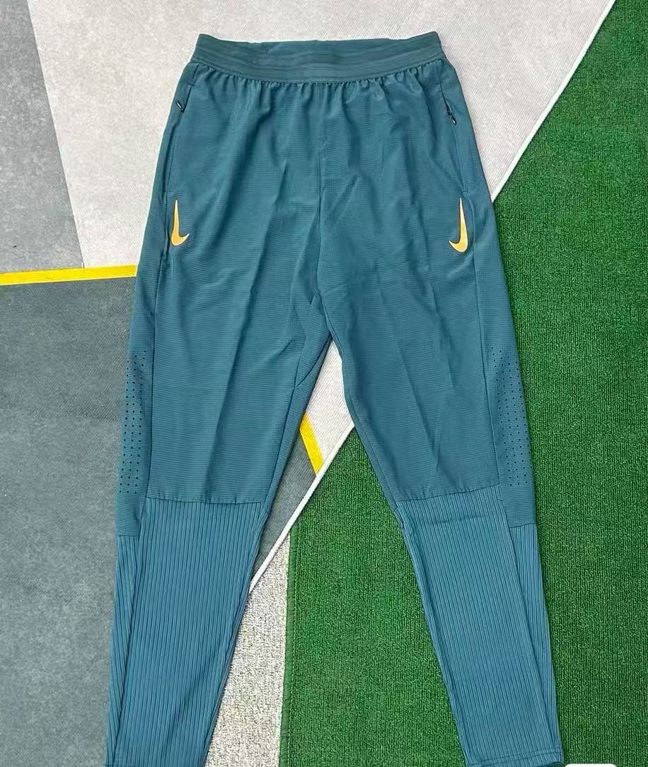 Pantalon de running Nike Dri-FIT pour homme, séchage rapide, logo Swoosh réfléchissant, ourlet côtelé, poches zippées, noir