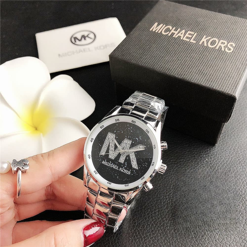 Classique Vente Chaude Femmes D'affaires Loisirs Montre À Quartz Simple Bande D'acier Plein Ciel Cadran Étoile