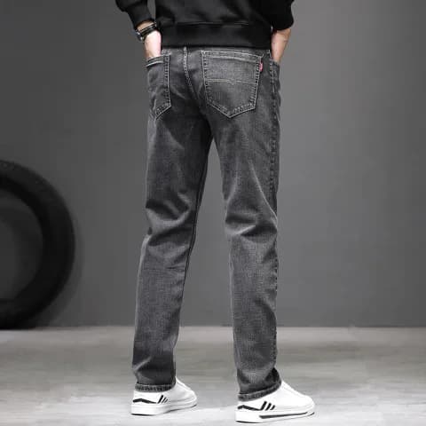 Jeans homme haut de gamme à jambes larges, coupe droite et ample, idéal pour le printemps et l'automne. Pantalon décontracté et tendance, élasti