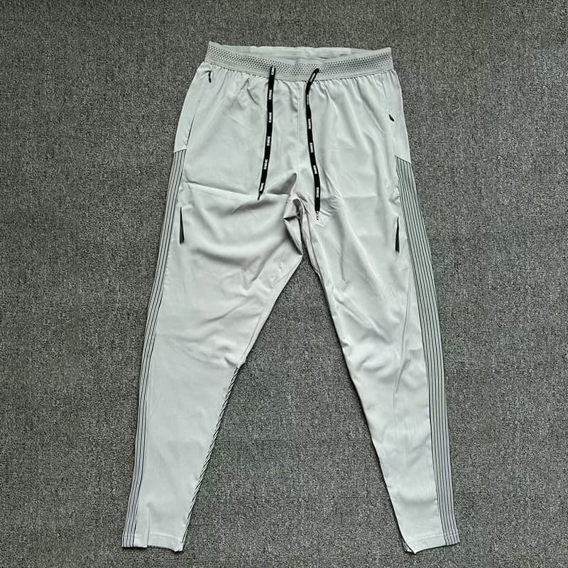 Pantalon de sport Elite Multi-Style pour homme, séchage rapide, respirant, coupe ample, patchwork, idéal pour la course en salle.