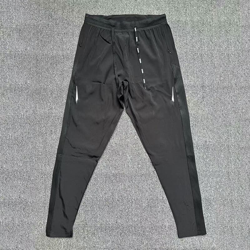 Pantalon de sport Elite Multi-Style pour homme, séchage rapide, respirant, coupe ample, patchwork, idéal pour la course en salle.