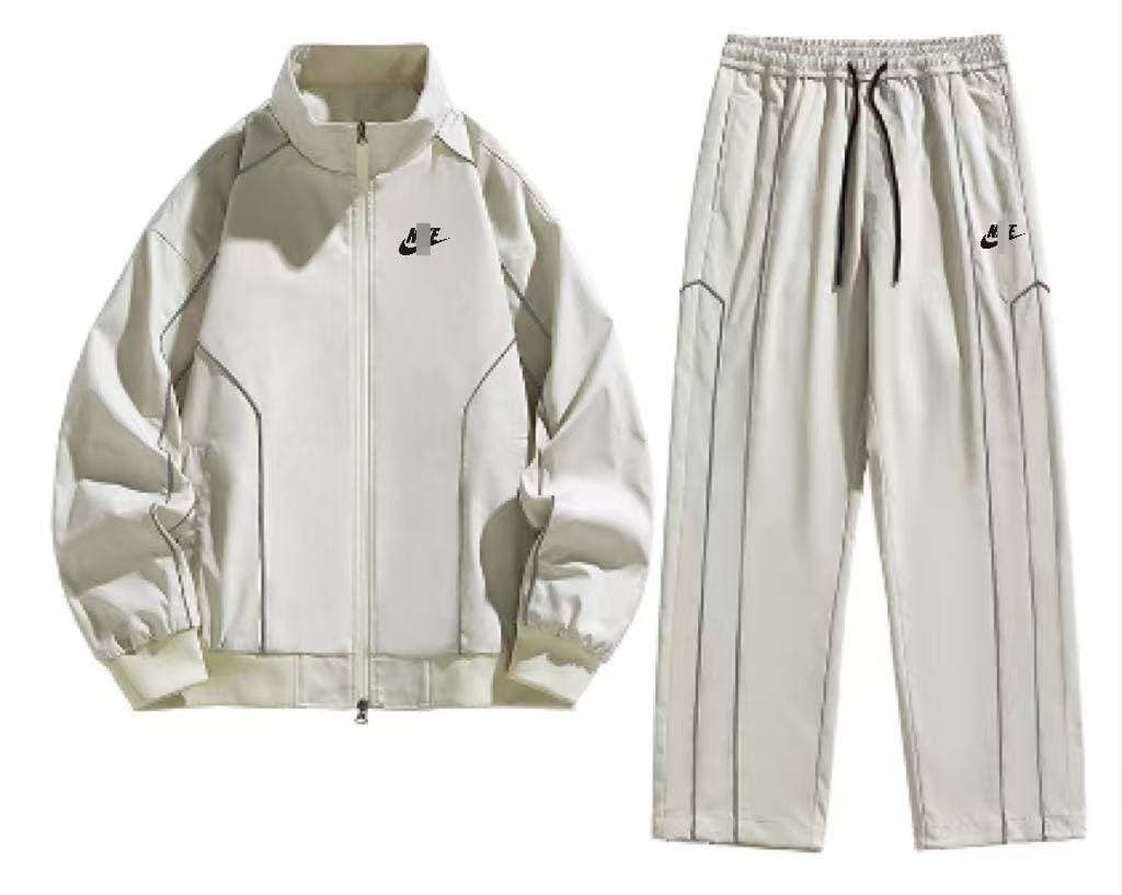 Ensemble de sport 2 pièces pour homme Nlke : veste zippée à bandes contrastées et pantalon large.
