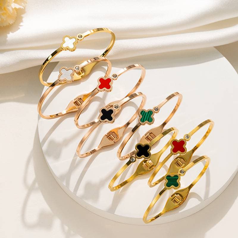 LuckyCharm's Golden Metal Bracelet With Four-Leaf Clover Design, Elegant Jewelry For Women, Fashionable Gift In Gold/Red/Black/Green