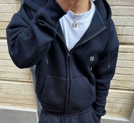 Pantalon de survêtement homme style hip-hop urbain, capuche zippée, manches longues, polyester noir, coupe basique micro-élastique, idéal pour le