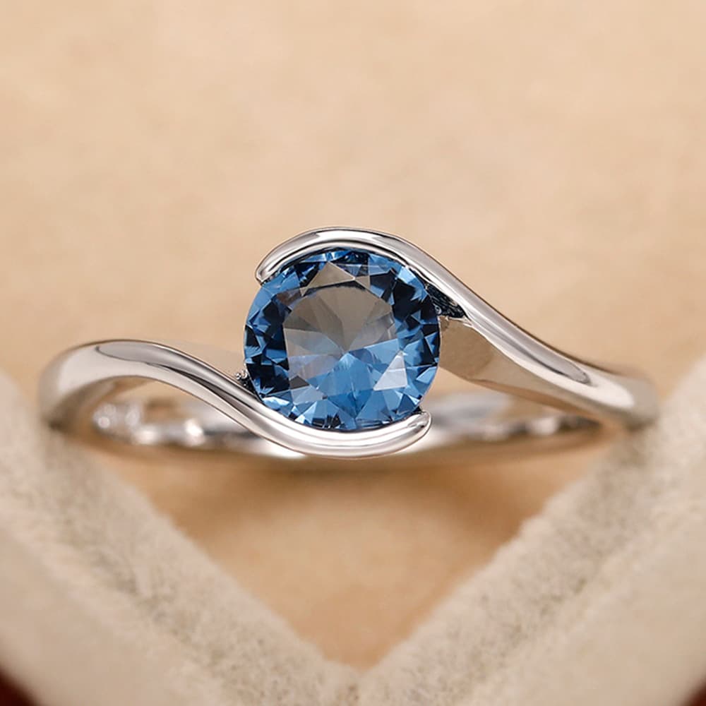 Cao Shi Jewelry Handwear Fashion Twist Arm Blue Round Diamond Zircon topaz Simple Women's Ring