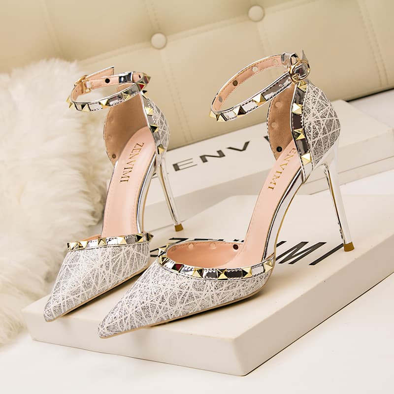 Sexy skinny-heeled club women's shoes High-heeled shallow pointed head hollowed out rivet one-line strap sandals