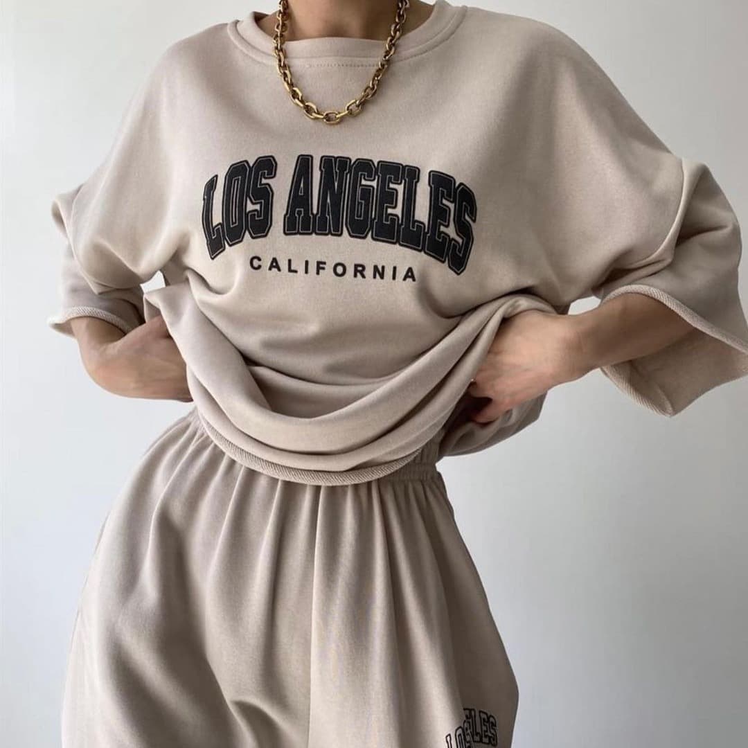 Spring New Women's Casual Commuting Printed Short Sleeved Sweatshirt And Trousers Two Piece Suit