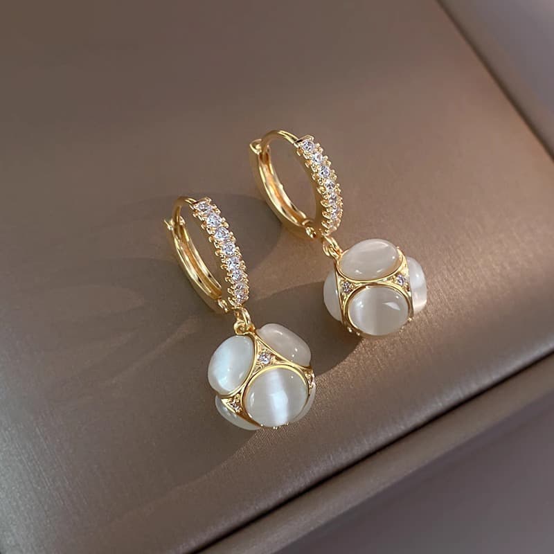 Unisex silver needle Japanese and Korean cat's eye stone earrings for women new earrings high end earrings ball earrings