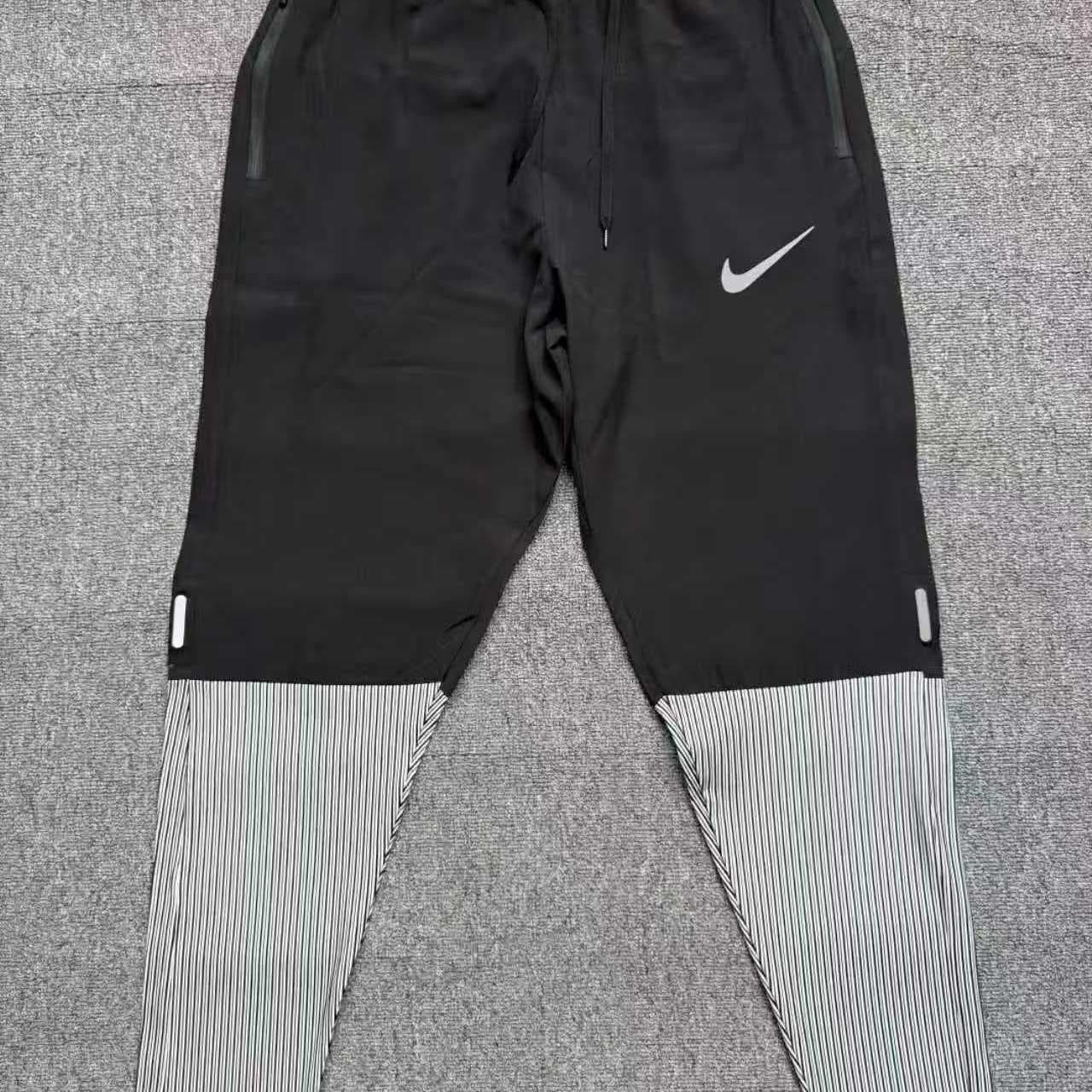 Pantalon de sport à séchage rapide pour homme et femme, respirant, coupe droite, idéal pour la course à pied et le marathon. Fermeture éclair.