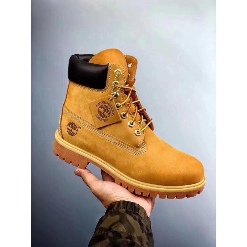 Bottes de neige montantes en cuir jaune Martin, collection automne/hiver 2026, pour hommes et femmes, indestructibles et imperméables.