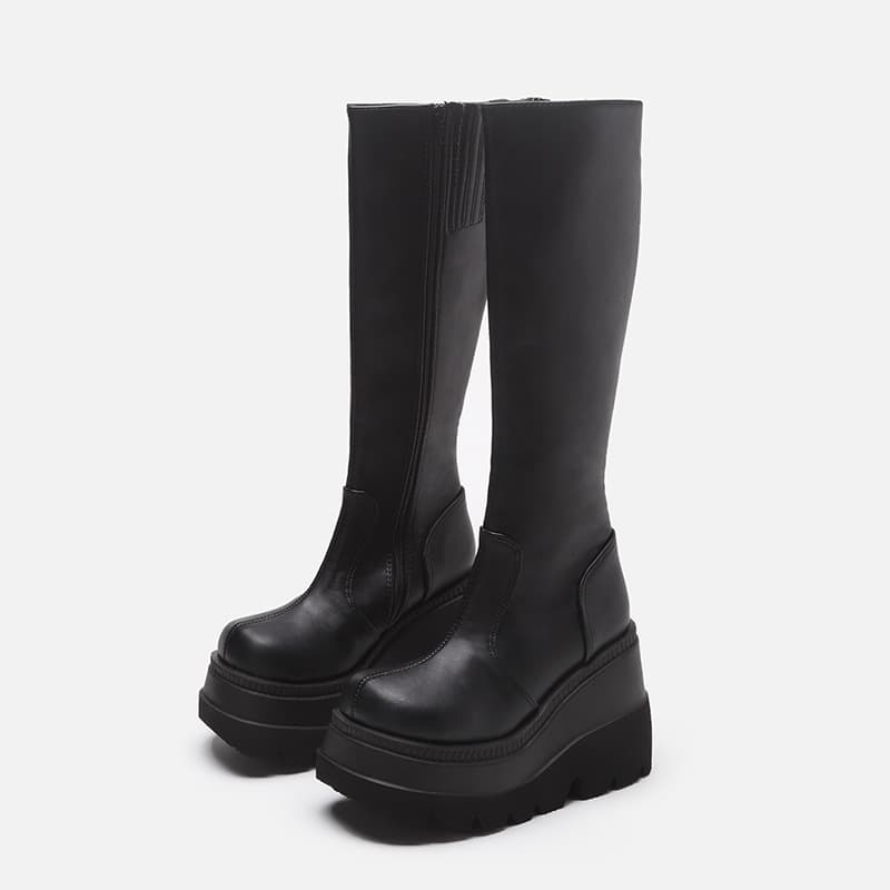 Biker rider boots no longer than the knee with a thin head