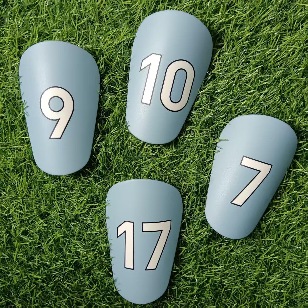 Adjustable Soccer Shin Guards With Player Number Designs (7,9,10,17) - Lightweight Plastic Leg Protection For Football, Basketball & Volleyball