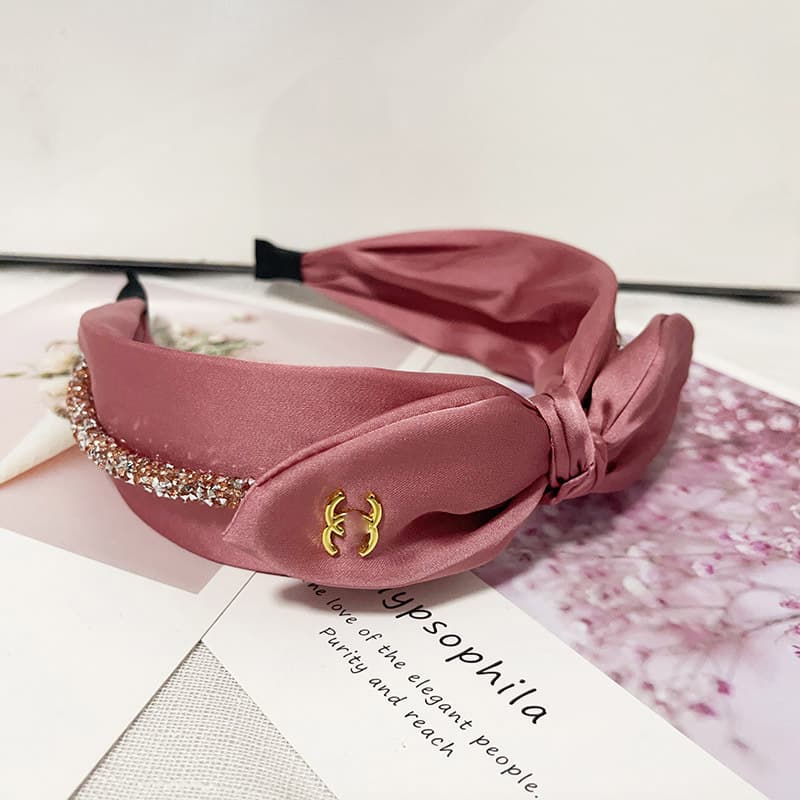 Bandeau en éponge rose à nœud haut, accessoire de cheveux simple et mignon, collection printemps/été 2026.