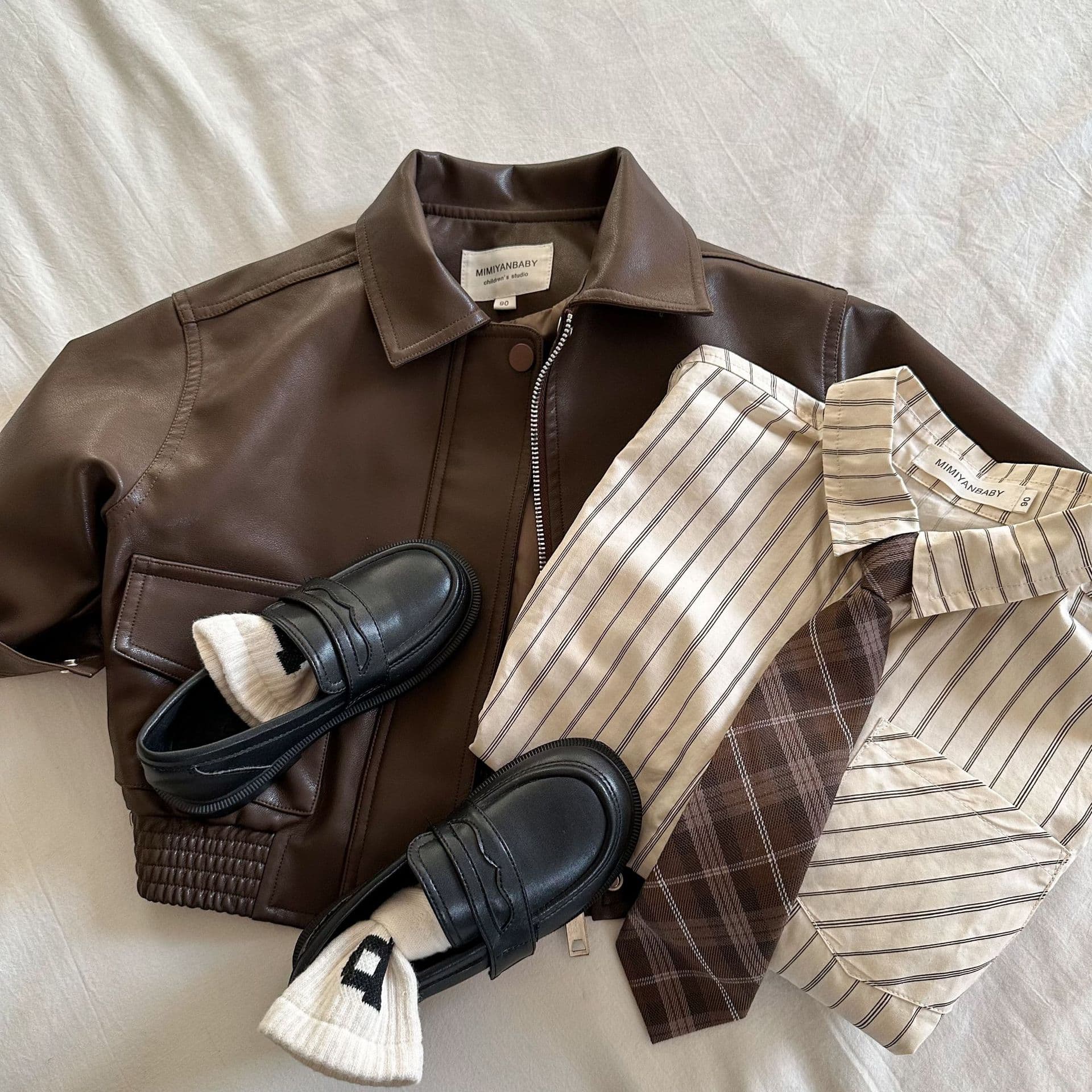 Children's Coat 2025 Squinting Autumn New Boys And Girls Solid Color Lapel Leather Jacket Baby Short Coat Trend