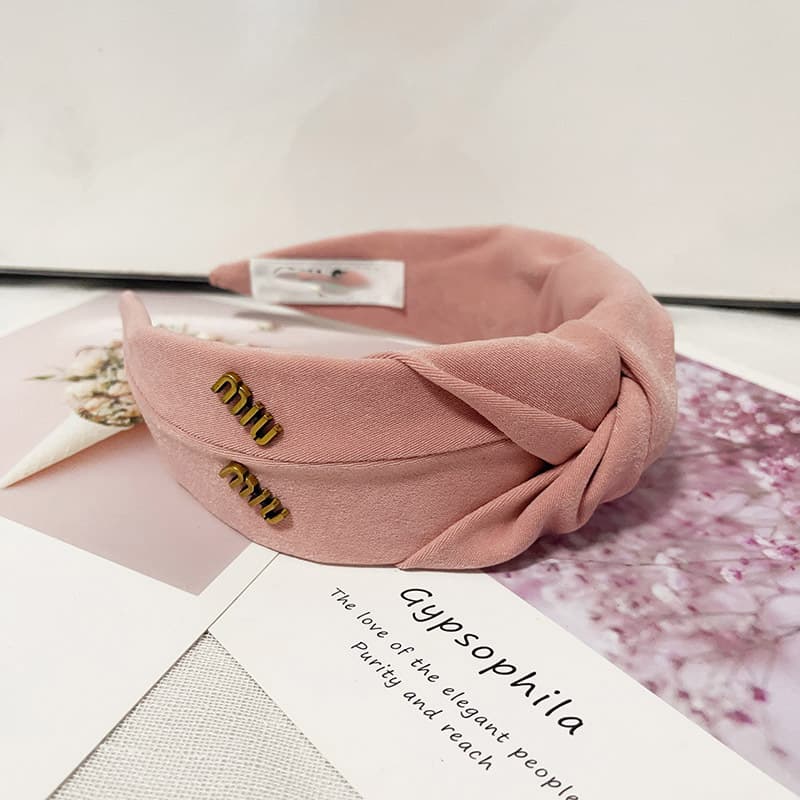 Bandeau en éponge rose à nœud haut, accessoire de cheveux simple et mignon, collection printemps/été 2026.