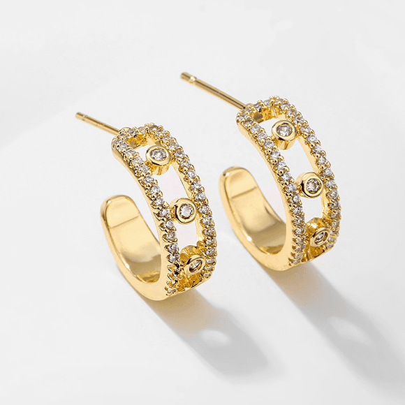 Famous classic temperament small dewdrop zircon ear clip female gold plated European and American diamond hollow musical note earrings
