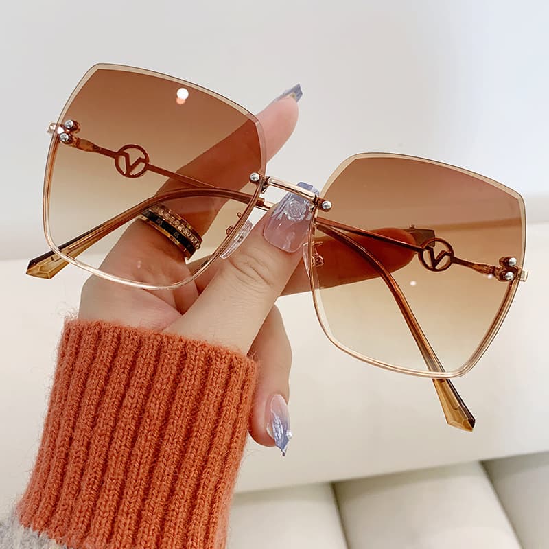 2024 New frameless cut edge women's fashion metal large frame gradient light sunglasses for driving sun visors ins