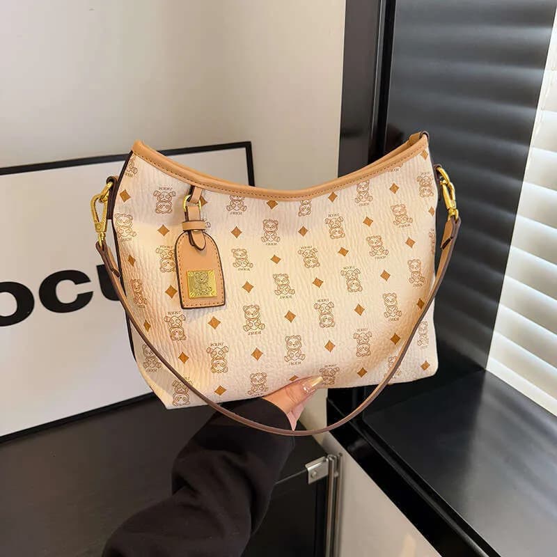 Sacs de luxe pour femmes, collection 2025 : cabas imprimé grand format, élégant, bandoulière marron.